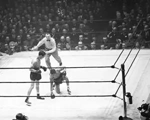 Arthur Donovan Prints: Fritzie Zivic Standing Over Henry Armstrong Kneeling Down