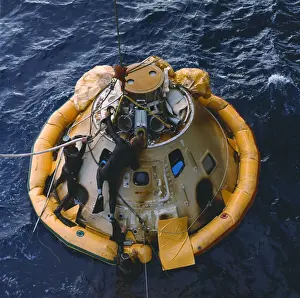 Frogmen Attaching Flotation Collar to Apollo VI Spacecraft