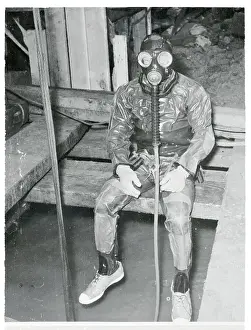 Frogmen Sitting on Ledge