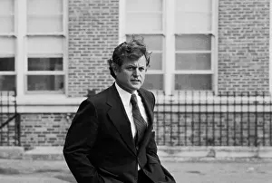 Georgetown Prints: A Frowning Senator Edward M. Kennedy Standing with His Hands in Pockets
