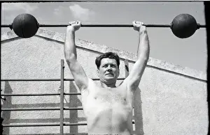 Full-Length Gene Tunney Lifting Weights