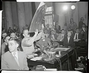 G. David Schine Holding up Evidence in Court