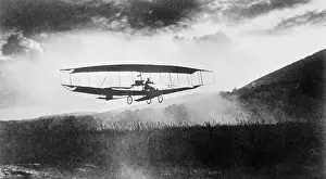Curtiss Prints: G. H. Curtiss Flying over Field