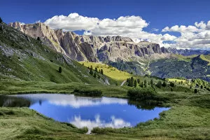 Images Dated 13th August 2016: Gardena valley reflecting in a pond on Seceda mountain