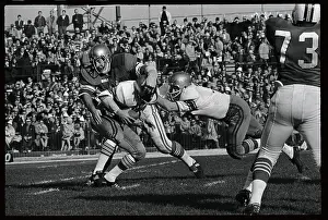 Prints of (Original Caption). West's QB Gary Beban, (16) Timeless Comedy Icons: Classic Moments from the Legendary Duo: Gary Beban and Kevin Hardy in Football Action