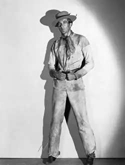 Gary Cooper Poses in Western Costume