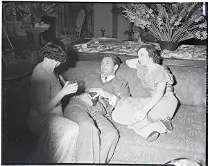 Country Club Prints: Gary Cooper Relaxes with two Women at Party