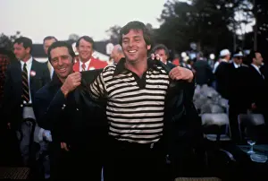 Gary Player Helping Fuzzy Zoeller with His Jacket