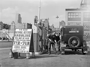 Closed Prints: Gas Attendant Filling Gas Cans
