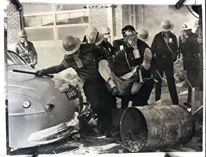 Picketing Prints: Gas-Masked Police Officers Drag Picket