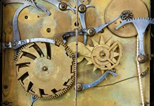 Gears and cogs in the clockwork of a historical pendulum clock, detail, regulator