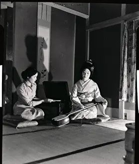 Geisha Girls Representing Past and Present Customs Sitting Together on Floor