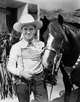 Rodeo Prints: Gene Autry Holding Champion