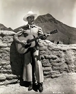 Tucson Prints: Gene Autry Singing with Guitar in The Last Roundup