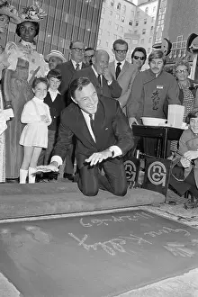 Gene Kelly Puts His Handprints In Cement