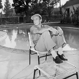 Pool Prints: Gene Kelly Seated At Poolside At Home