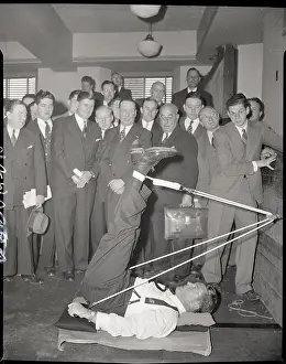 Stretching Prints: Gene Tunney Demonstrates Pulley Exercise