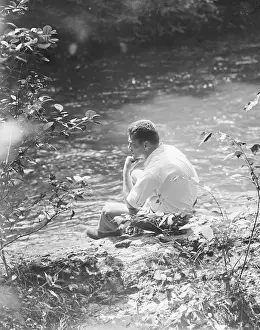 Thinking Prints: Gene Tunney Relaxing Beside Stream