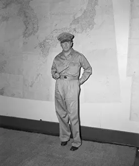 General Douglas MacArthur Holding Pipe