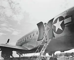 General Douglas MacArthur Stepping Off Airplane