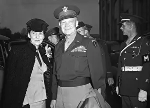 Prints of (Original Caption). General Dwight D. Eisenhower and wife as they arrived today at Union Station in Washington Eisenhower Unveiled: A Visual Journey Through History: General Eisenhower and Maime Eisenhower Arriving in Washington