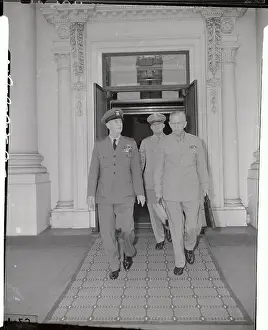 General H.H. Arnorld walking with Military Officials