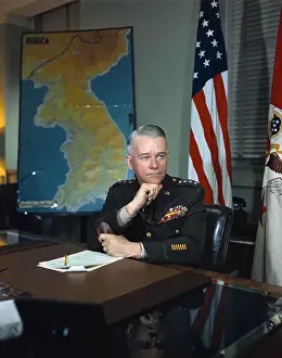 General J. Lawton Collins Sitting at Desk