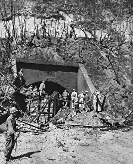General MacArthur and Officers Observing Bombed region