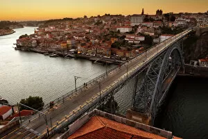Buildings Collection: General view of Douro river and city of Oporto al sunset. Porto (Oporto), Portugal