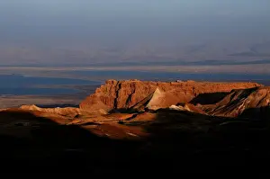 General view of Masada an ancient fortification situated on top of an isolated rock plateau on the eastern edge of the Judaean Desert, overlooking the Dead Sea in Israel
