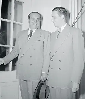 Generoso Pope and Son Talking Together