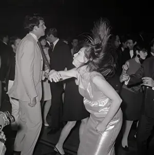 Popular Prints: Gentleman Strolls By As Woman Dances