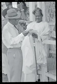 Lagos Prints: Gentlemen Comparing Race Tips