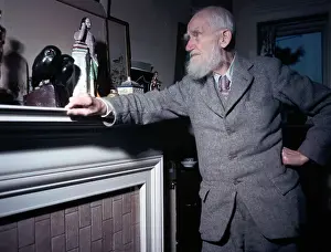 George Bernard Shaw Standing at Mantel