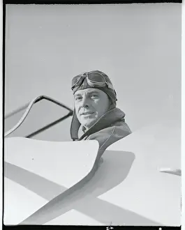 George Brent Sitting in an Airplane