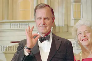 George Bush Gesturing a Sign