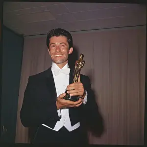 George Chakiris Holding His Oscar