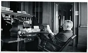 George Eastman Seated at His Desk