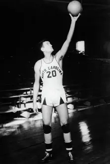 Prints of George Glamack, center, North Carolina University basketball team, 1938-1939 Hoops Through Time: A Visual Journey of Basketball History: George Glamack