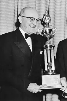George Halas Holding Trophy