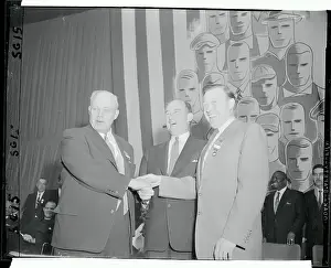 George Meany and Walter Reuther Shaking Hands with Adlai Stevenson