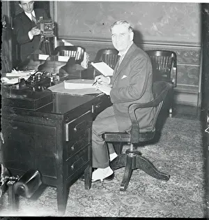 George H Prints: George U. Dern Sitting at Desk