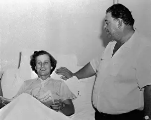 George Zaharias Visiting Babe Didrikson in Hospital