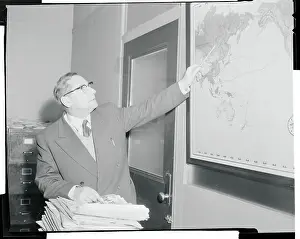Georgi Okolovich Pointing to a Map