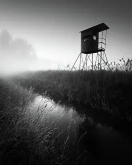 Uninhabited Prints: German floodplain landscape in Brandenburg with high seat on the Nuthe in black and white