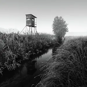Uninhabited Prints: German floodplain landscape in Brandenburg with high seat on the Nuthe in black and white
