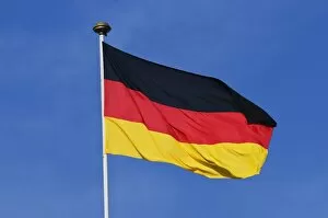Images Dated 23rd March 2011: German national flag against blue sky