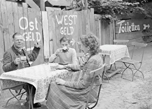 German Patrons at Outdoor Bargain Counter