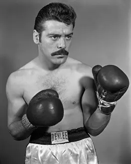 Prints of BRONX, NY - MAY 14: Middleweight professional boxer Germinal Ballarin of Luxembourg poses for a portrait on May14, 1957 in the Bronx, New York. (Photo by Stanley Weston/Getty Images) In the Ring: The Art of Boxing: Germinal Ballarin Studio Portrait
