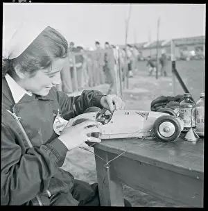 Gianpaola Turri Preparing Miniature Car for Race